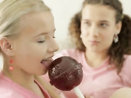 Two Lesbian Girlfriends Love Licking A Huge Lollipop