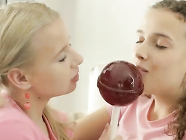 Two Lesbian Girlfriends Love Licking A Huge Lollipop